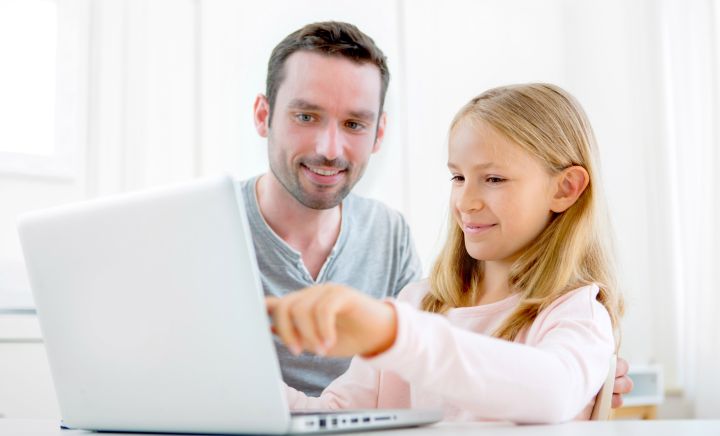Father and Daughter undertaking Distance Education