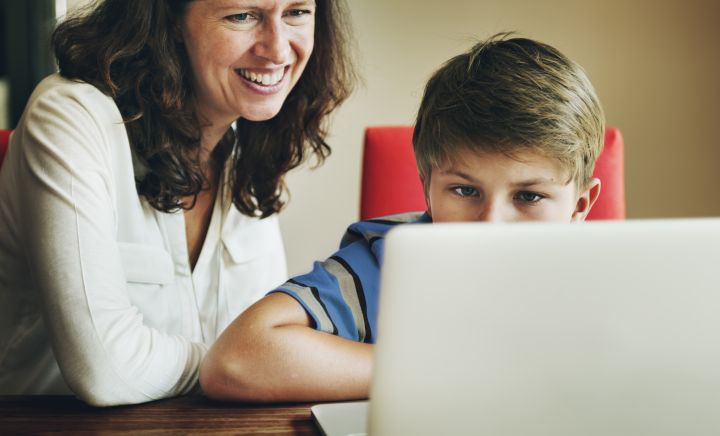 Mother and Son undertaking Distance Education