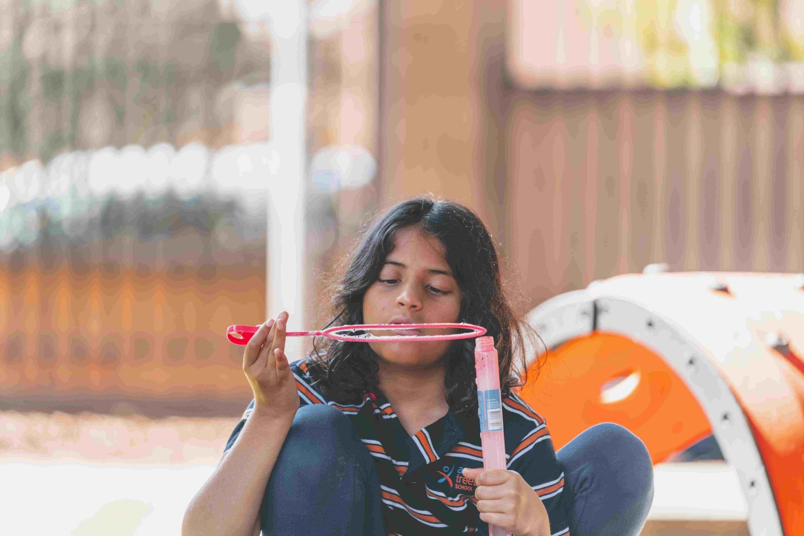 Student blowing bubbles