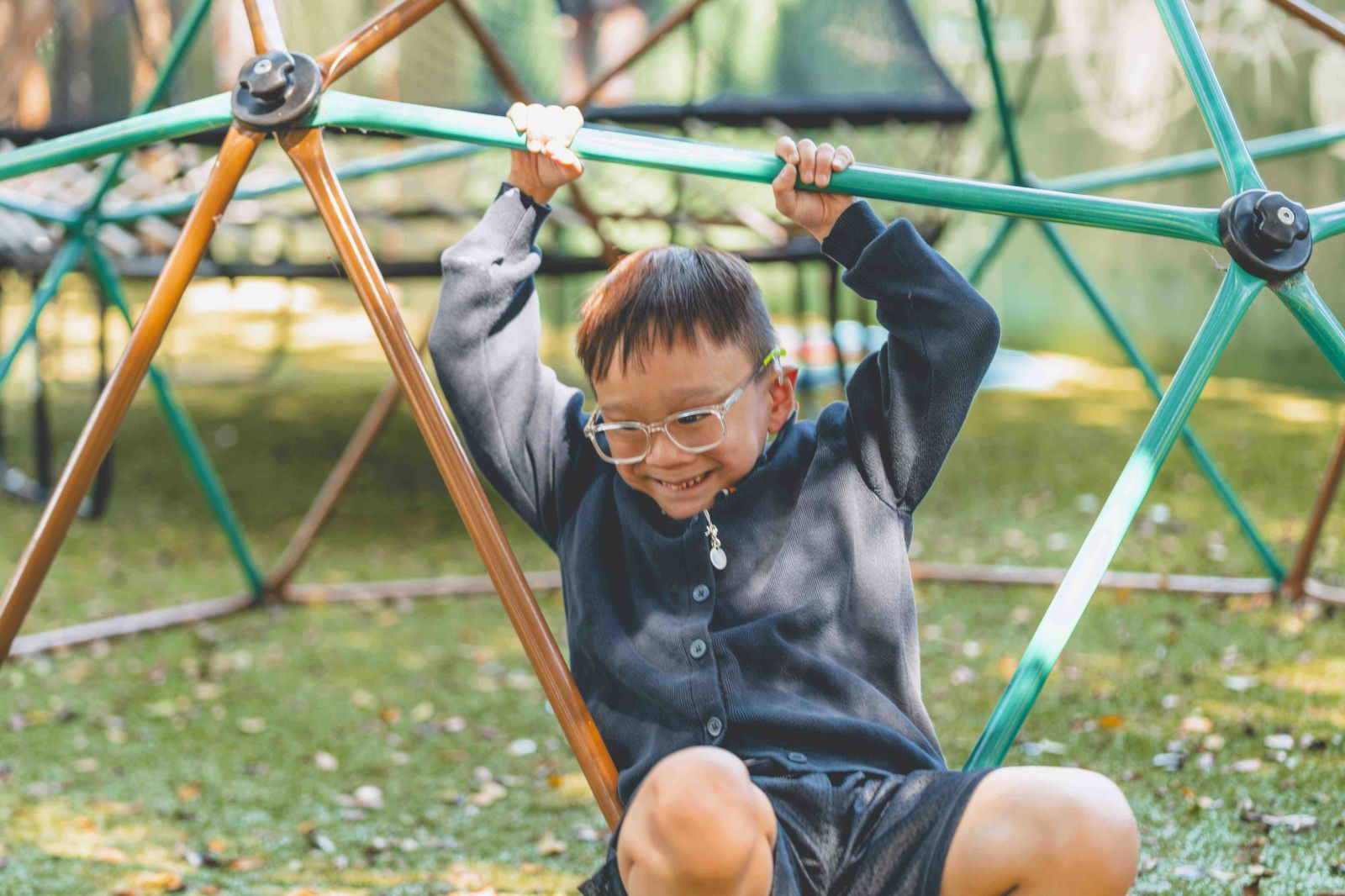 Student climbing on climbing frame