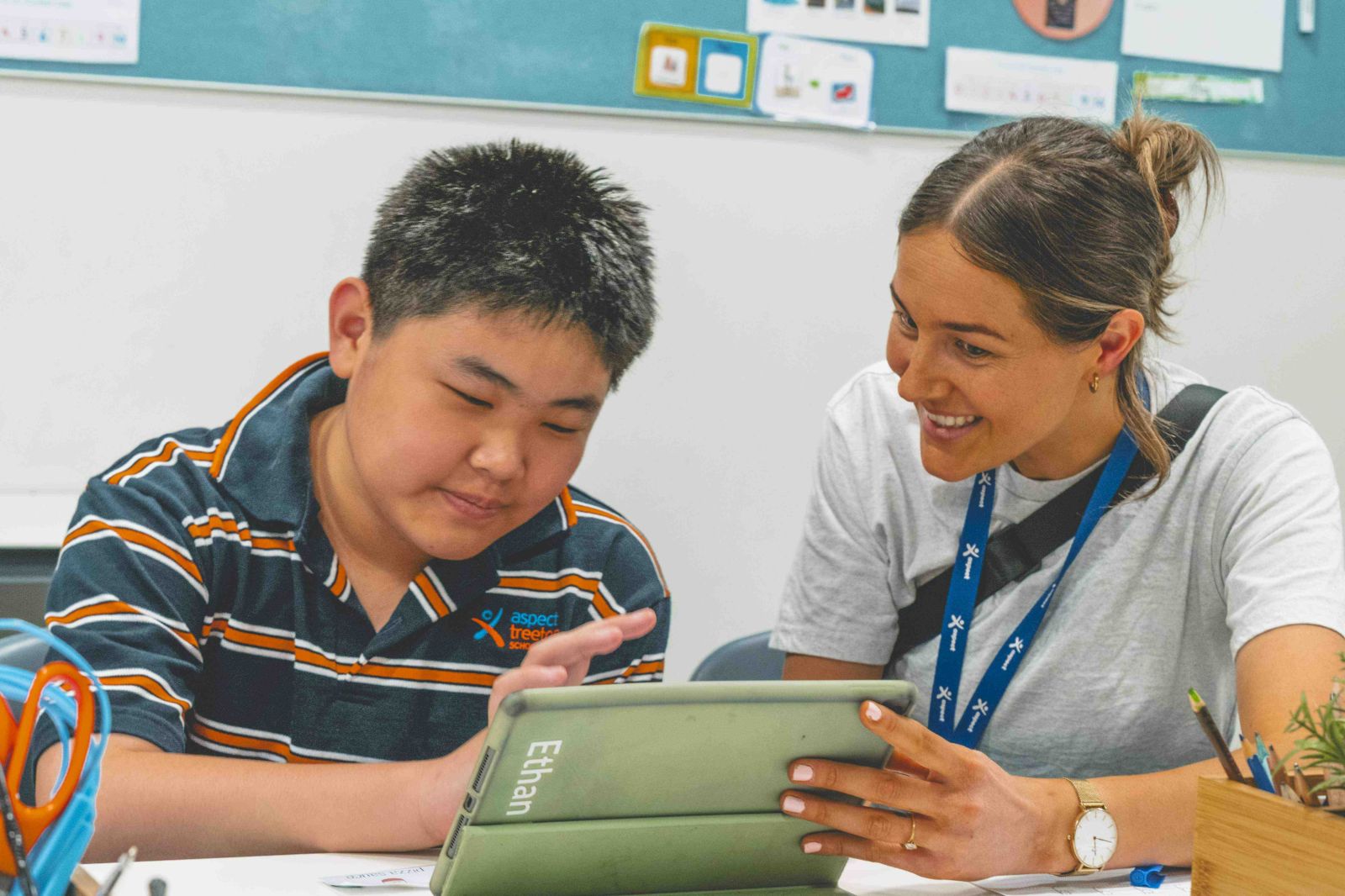 Student and teacher completing work on an Ipad