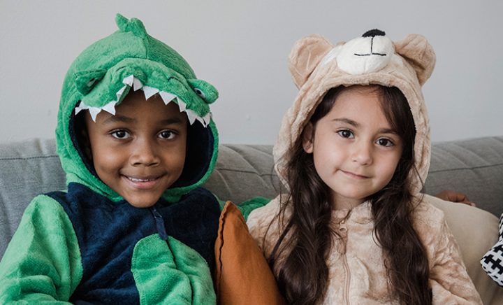 Two young children in onesies